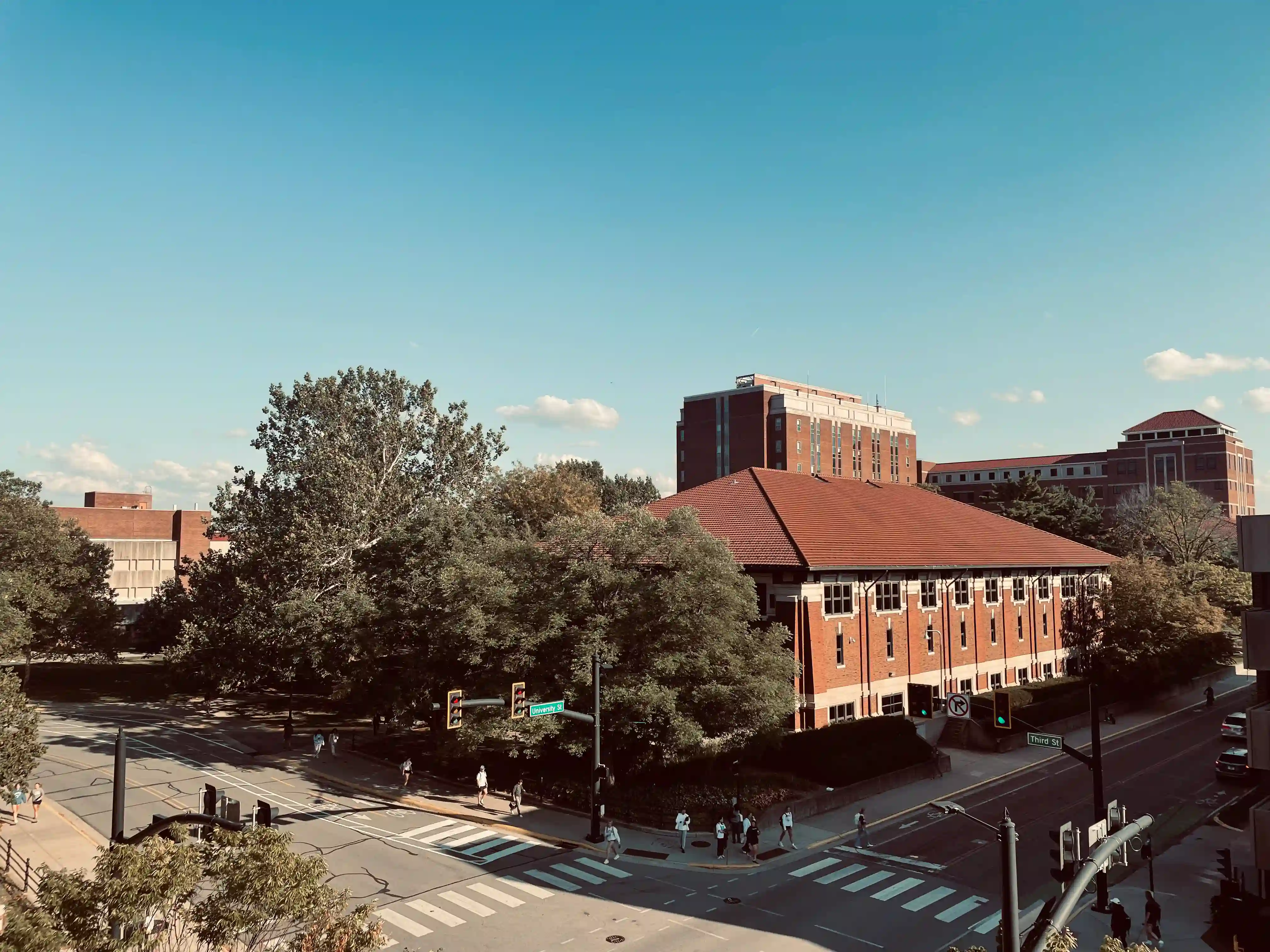 An image taken from the Balcony of Lawson Computer Science Building of the intersection of University Street and Third Street. In the foreground, the intersection of the two roads is visible, behind which Felix Haas Hall features prominently. Beering Hall and the Mathematical Sciences Building are also visible towards the right.